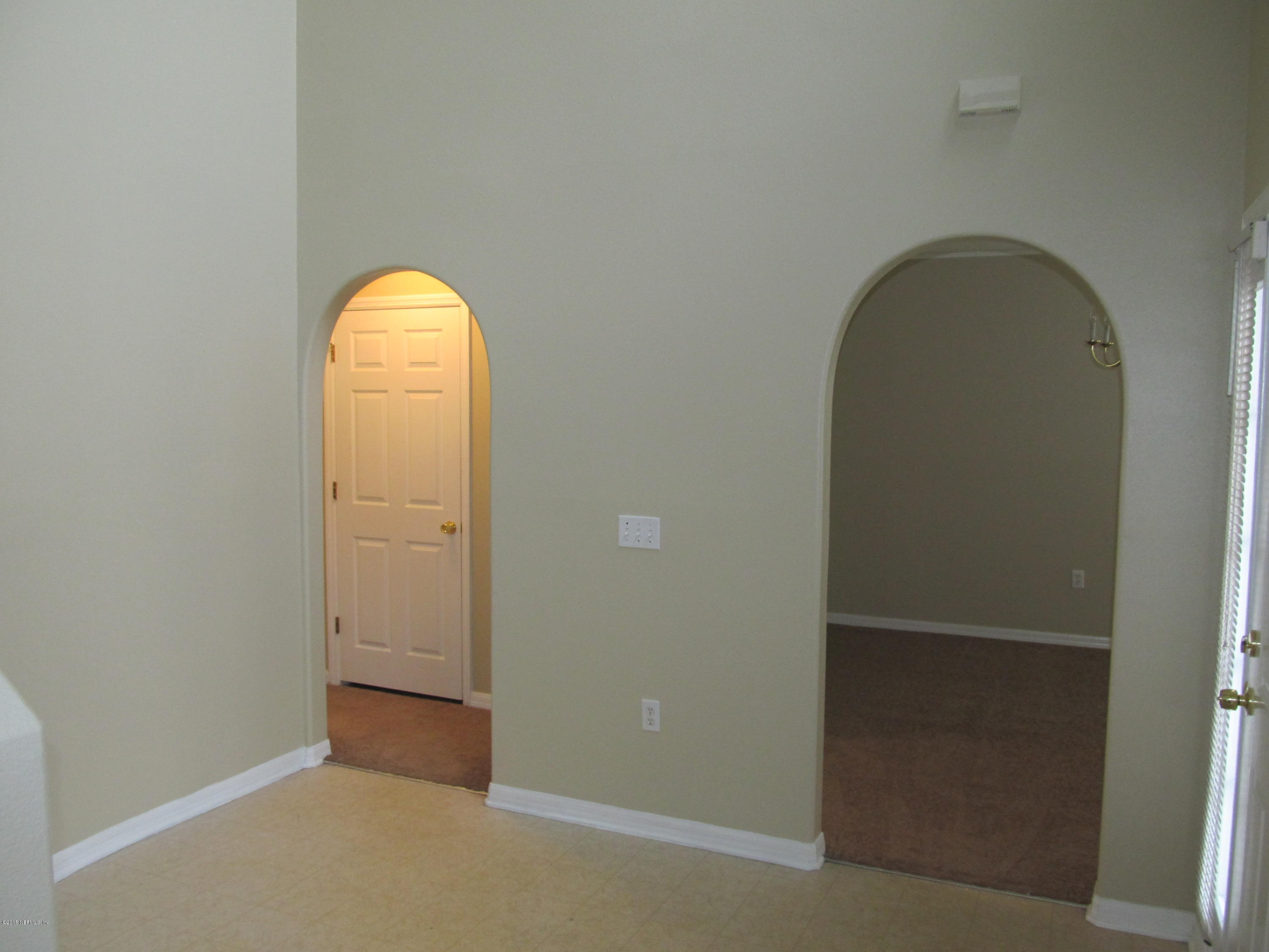 7079 Prosperity Park Road East Jacksonville, FL 32244 - Photo 7 of 22 an empty room with a door