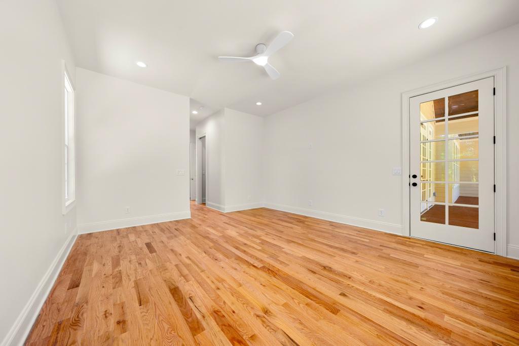 707 Vickery Street Extension Hartwell, GA 30643 - Photo 19 of 50 Hardwood floors and a ceiling fan define this spacious, versatile room.