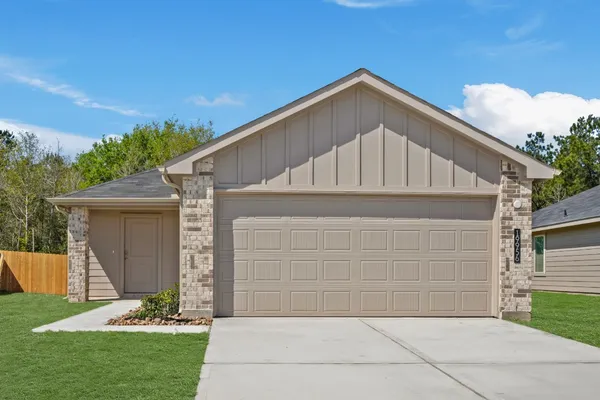 a front view of a house with garage