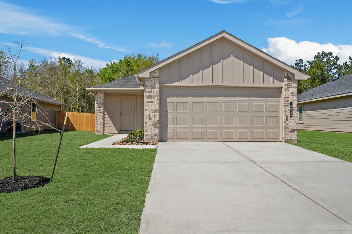 19956 Hilbert Road New Caney, TX 77357 - Photo 2 of 27 a view of backyard of house with green space