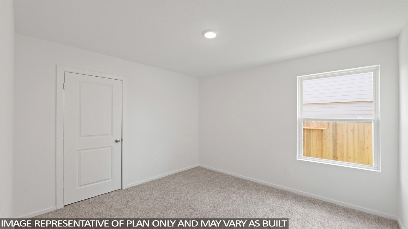 19956 Hilbert Road New Caney, TX 77357 - Photo 9 of 27 an empty room with a window