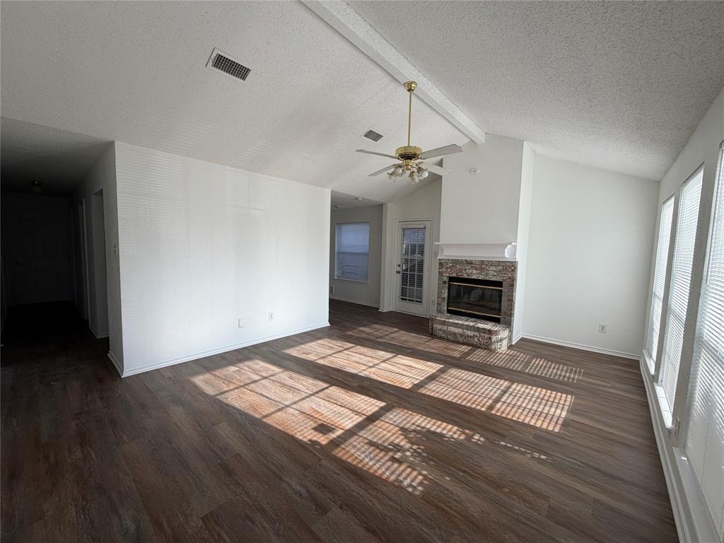 7116 Nohl Ranch Road Fort Worth, TX 76133 - Photo 3 of 10 Living room with wood burning fireplace