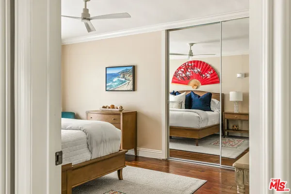 a bedroom with bed and furniture