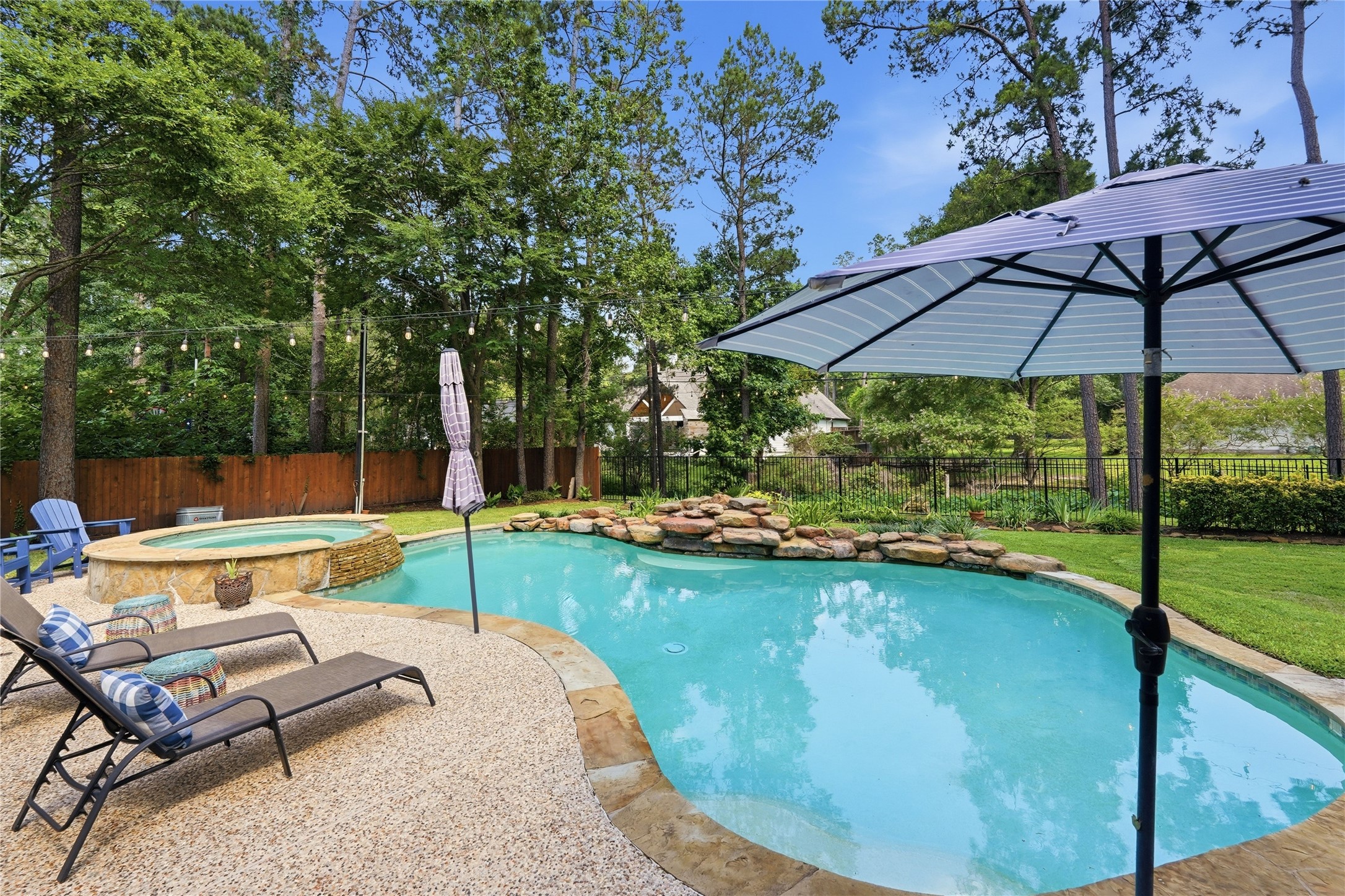 2408 Hollowbrook Lane Conroe, TX 77384 - Photo 36 of 49 View of the lovely back yard pool and spa! What a view!