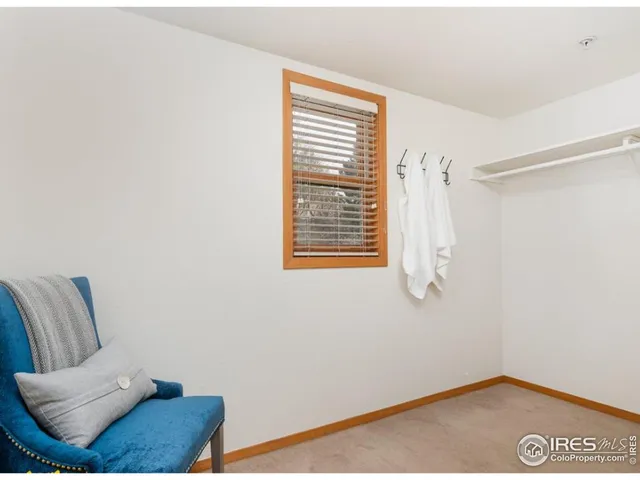 a view of a room with furniture and a window