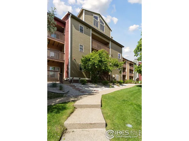 a view of a building with a yard