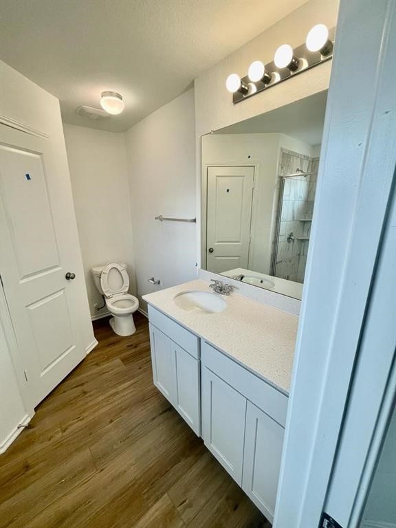 420 Perfect World Loop Jarrell, TX 76537 - Photo 11 of 17 a spacious bathroom with a granite countertop sink and a mirror