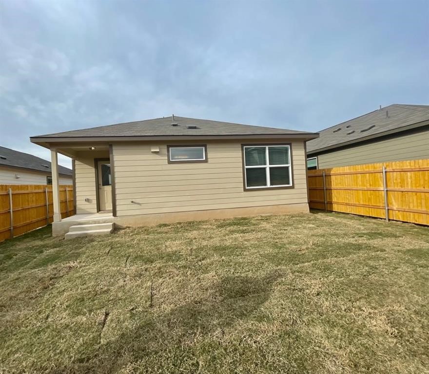 420 Perfect World Loop Jarrell, TX 76537 - Photo 16 of 17 a view of a house with a backyard