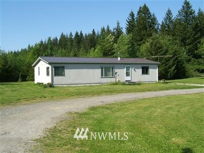 8951 Heady Road Maple Falls, WA 98266 - Photo 1 of 1 a front view of house with yard and green space