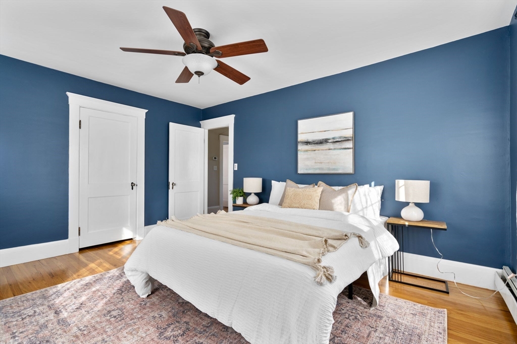 15 Laird Road Medford, MA 02155 - Photo 18 of 42 a bed room with a bed and a ceiling fan