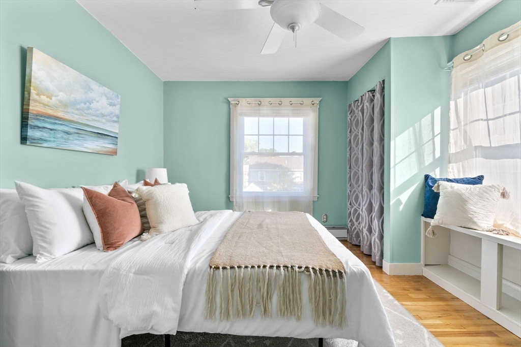 15 Laird Road Medford, MA 02155 - Photo 19 of 42 a bedroom with a large bed and a window