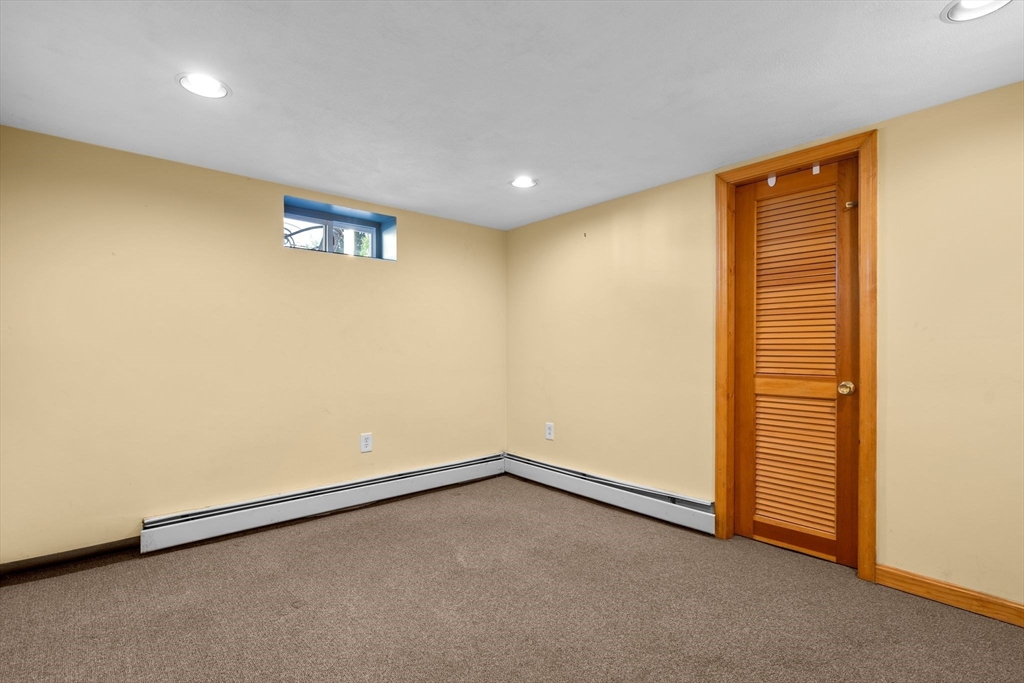 15 Laird Road Medford, MA 02155 - Photo 23 of 42 an empty room with a empty space