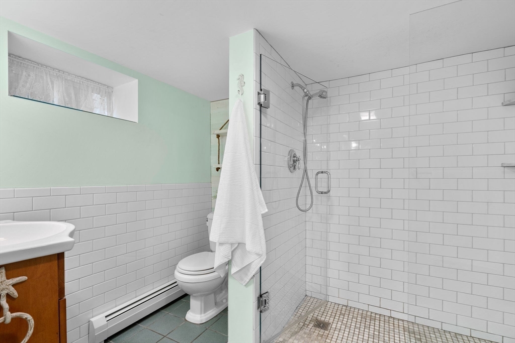 15 Laird Road Medford, MA 02155 - Photo 25 of 42 a bathroom with a toilet and a shower