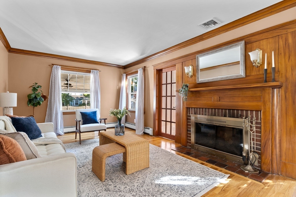 15 Laird Road Medford, MA 02155 - Photo 3 of 42 a living room with furniture a window and a fireplace