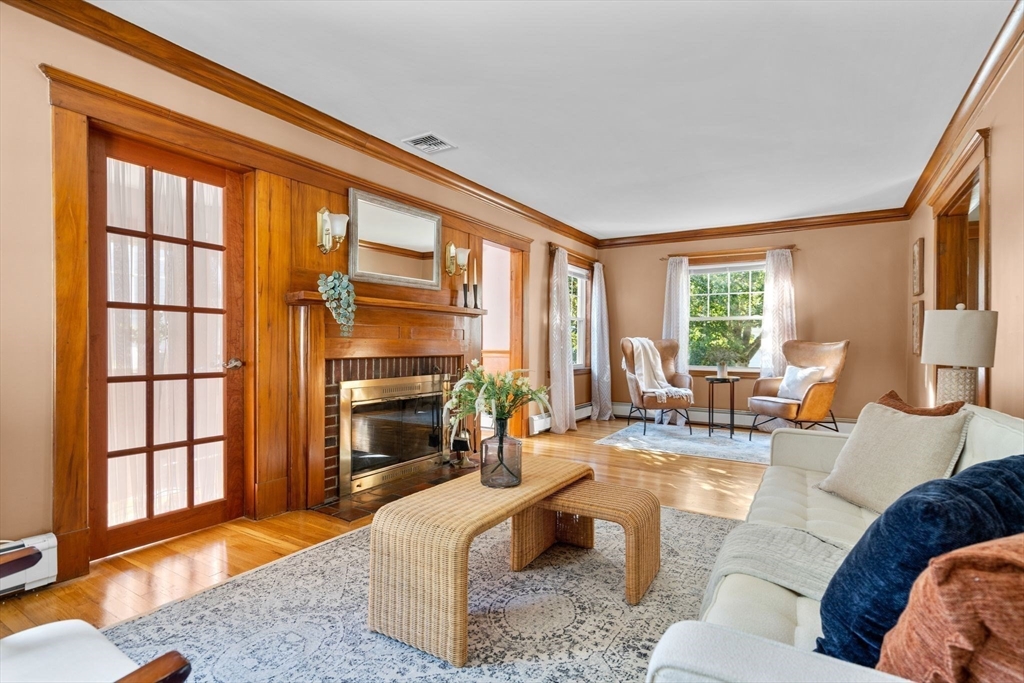 15 Laird Road Medford, MA 02155 - Photo 5 of 42 a living room with furniture and a fireplace