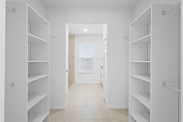 a view of an empty room with a closet