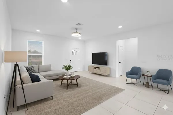 a living room with furniture and a flat screen tv
