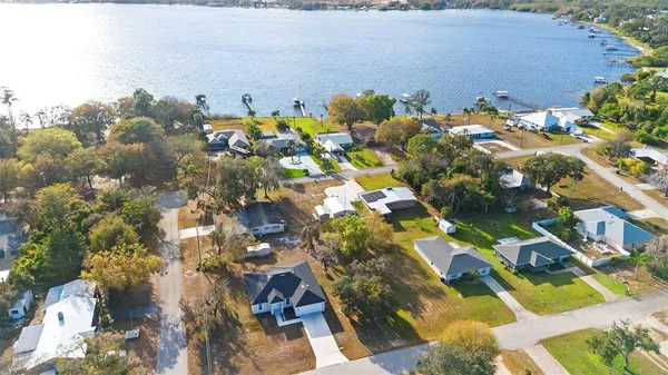 a large kitchen with white cabinets and stainless steel appliances