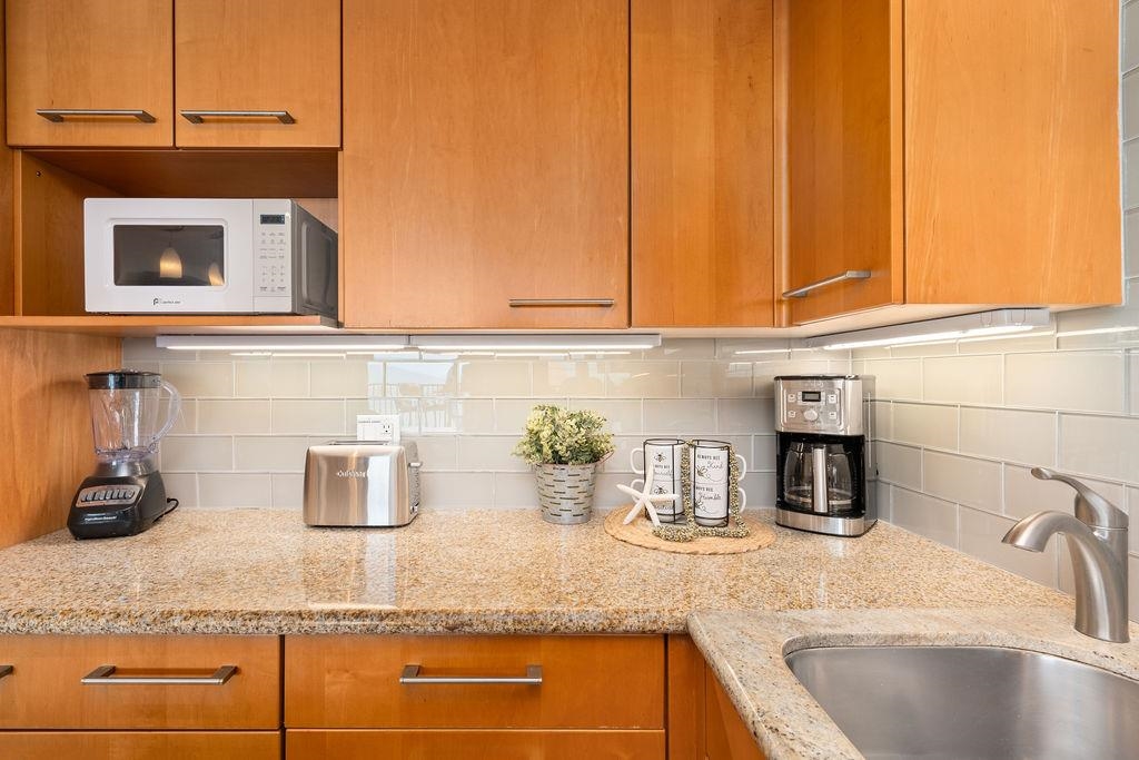 3785 Lower Honoapiilani Road, Unit 208 Lahaina, HI 96761 - Photo 5 of 50 a kitchen with counter top space and appliances