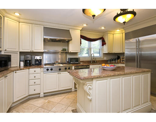 24 Kodaya Road Newton, MA 02468 - Photo 1 of 1 a kitchen with stainless steel appliances granite countertop a sink a stove and cabinets