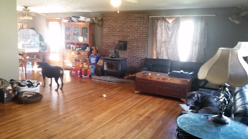48 Bushnell Road Sturbridge, MA 01566 - Photo 3 of 33 a living room with furniture and a fireplace