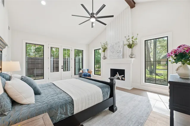 a bedroom with a bed and a fireplace