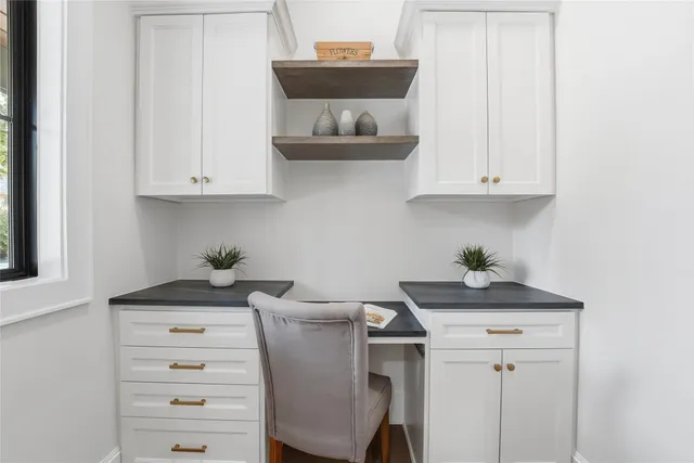 a kitchen with a stove and cabinets