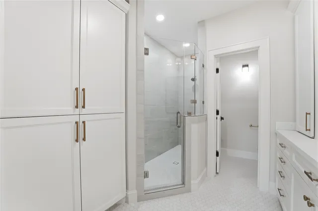 a bathroom with a shower and a tub