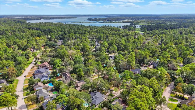 an aerial view of a houses with a yard
