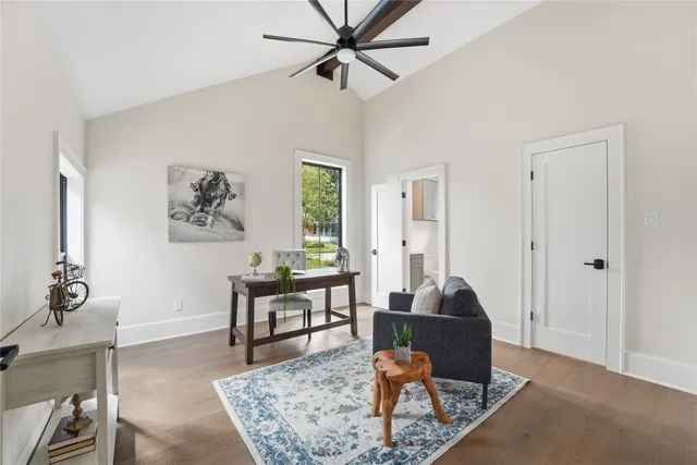 a living room with furniture a rug and a window