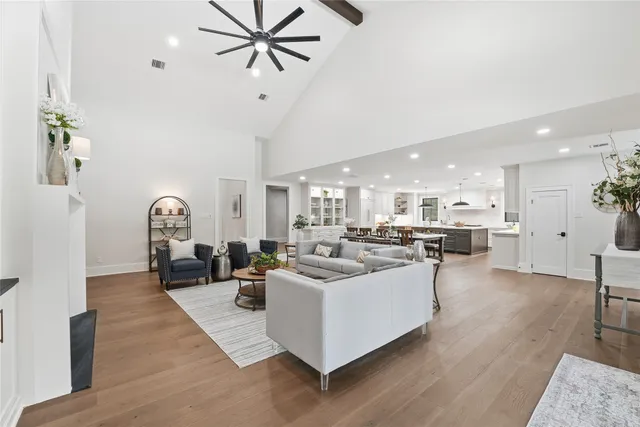 a living room with furniture and a clock