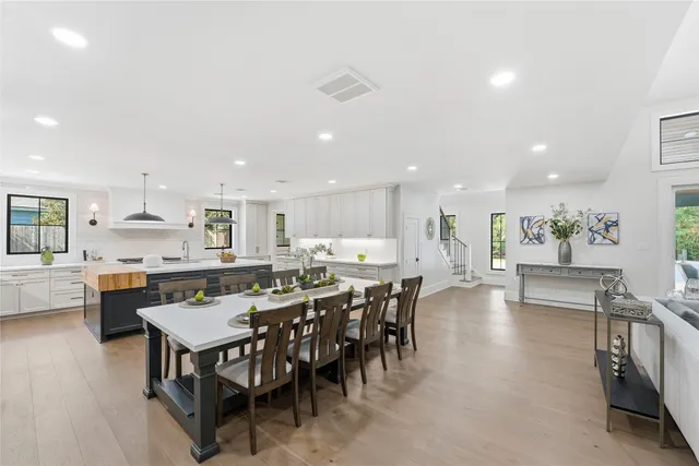 a view of a dining area with furniture and wooden floor