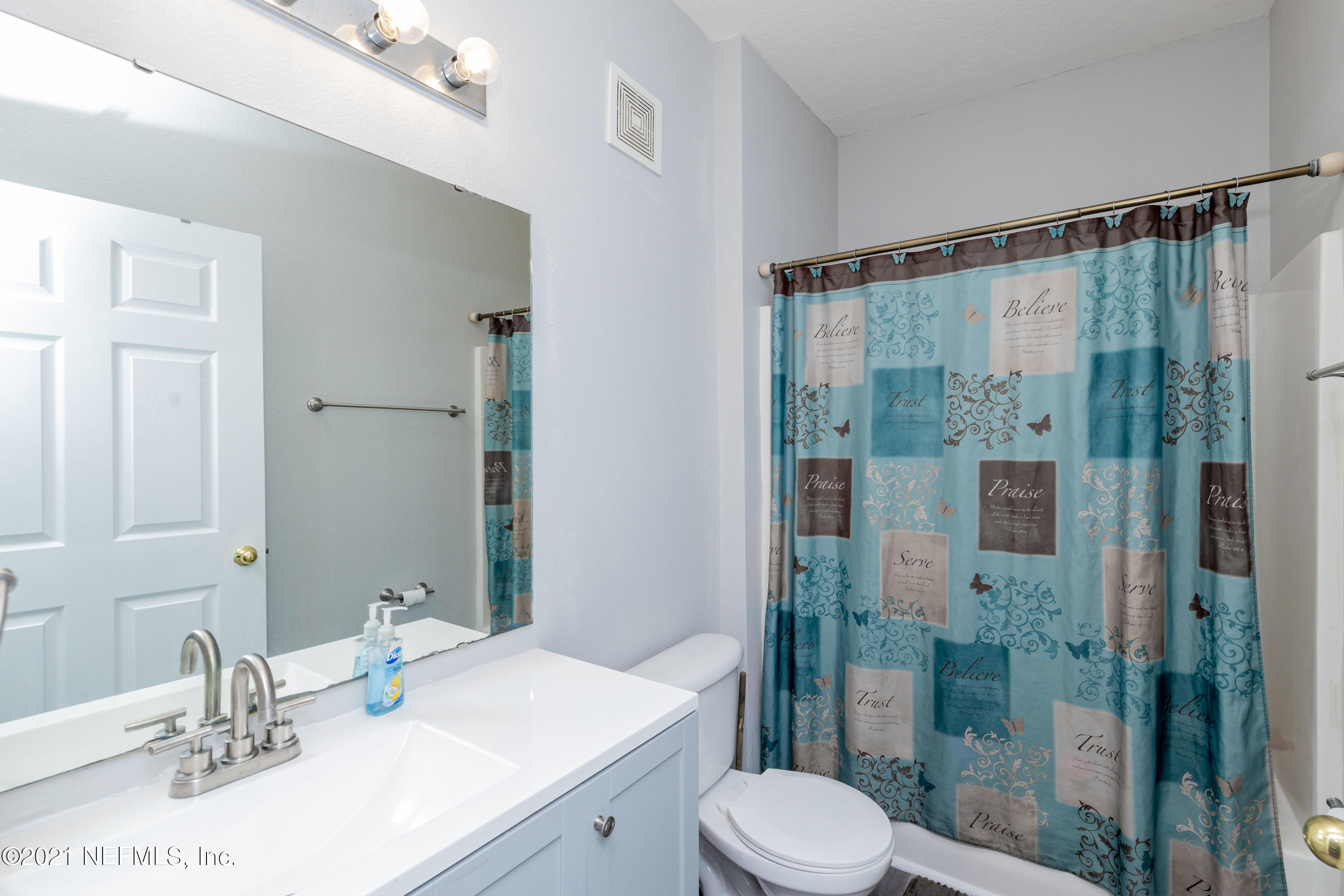 3670 Kirkpatrick Circle, Unit 2 Jacksonville, FL 32210 - Photo 13 of 17 a bathroom with a sink vanity granite toilet and shower