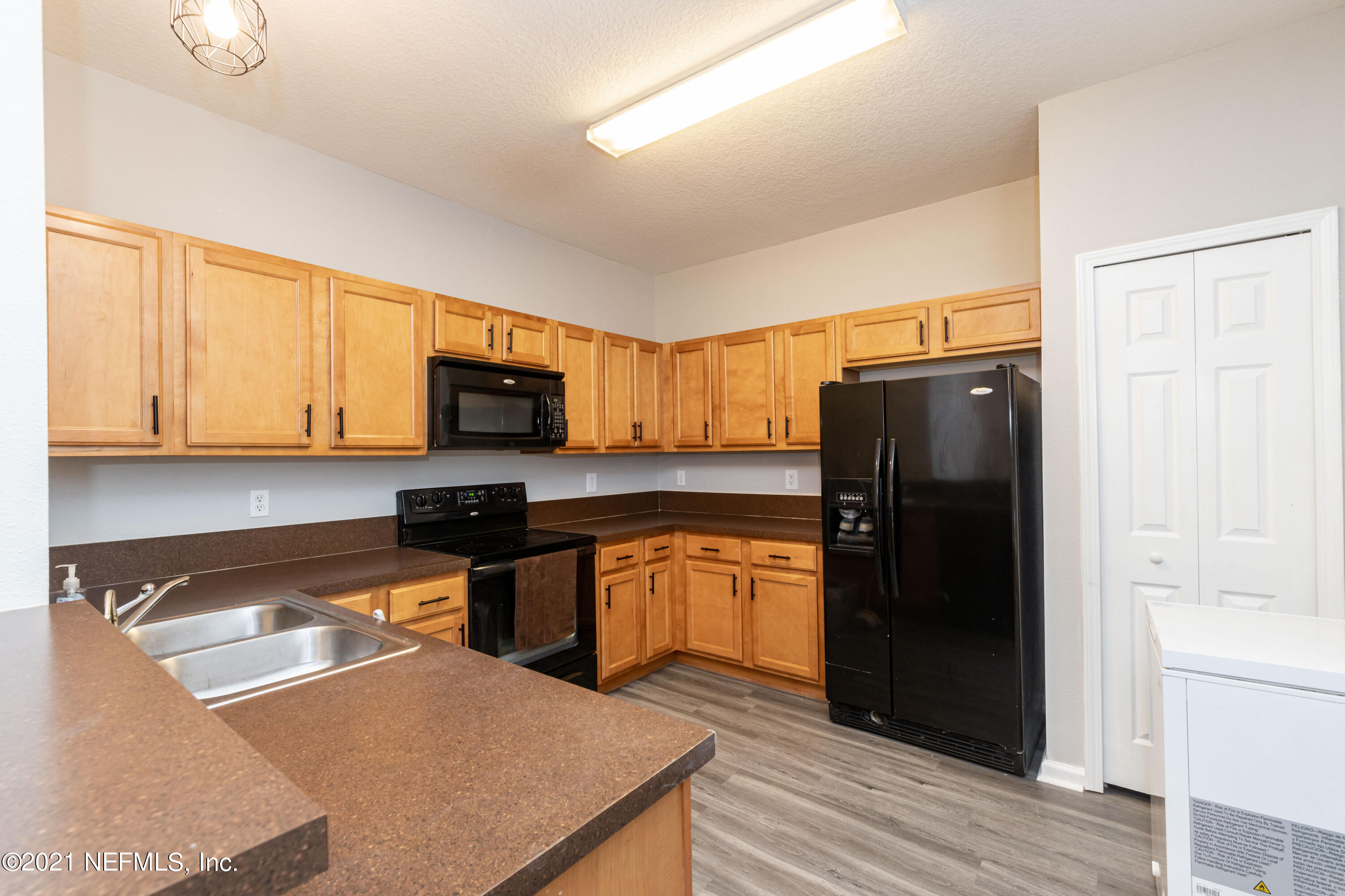 3670 Kirkpatrick Circle, Unit 2 Jacksonville, FL 32210 - Photo 4 of 17 a kitchen with stainless steel appliances granite countertop a refrigerator stove top oven and sink