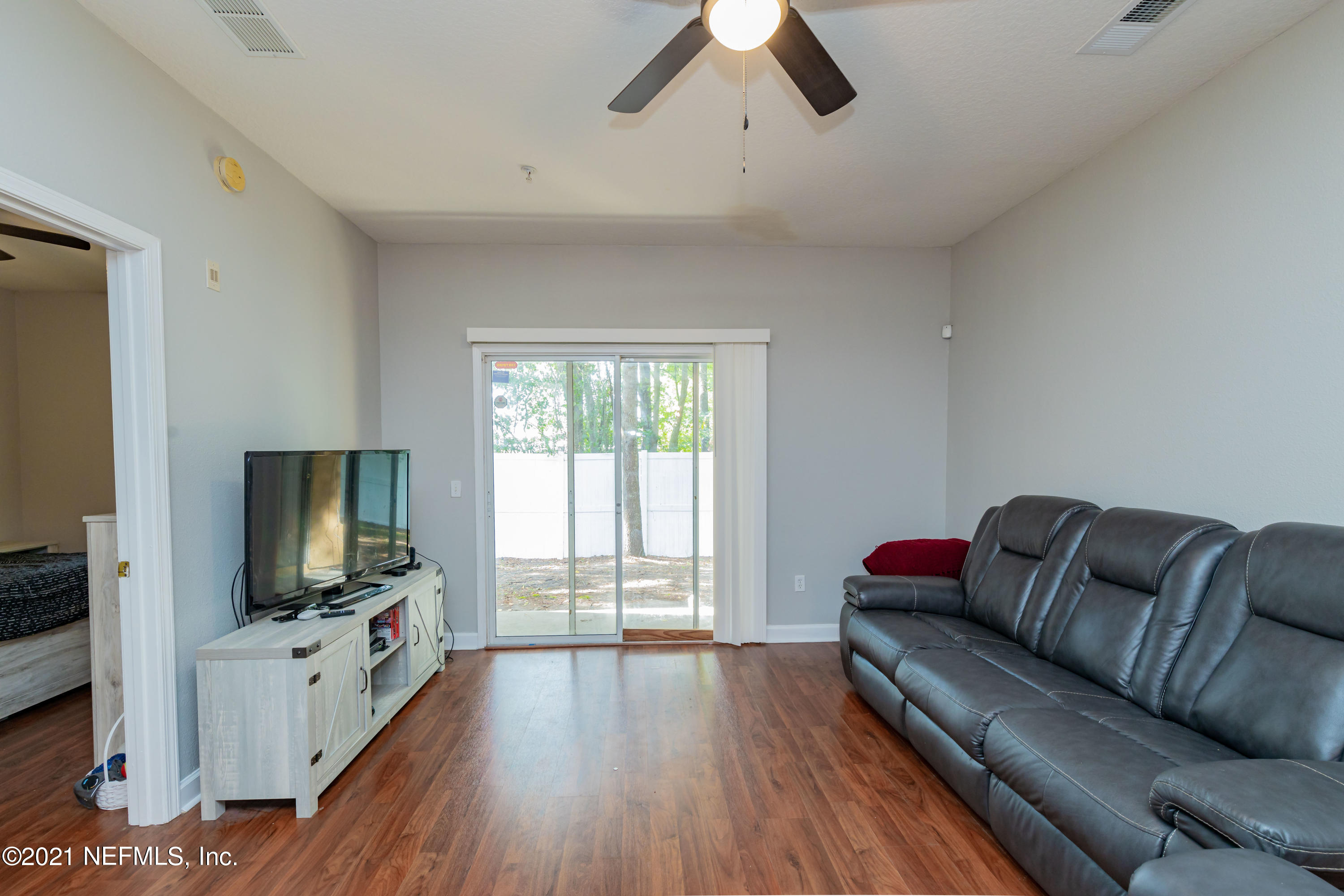 3670 Kirkpatrick Circle, Unit 2 Jacksonville, FL 32210 - Photo 7 of 17 a living room with furniture and a flat screen tv