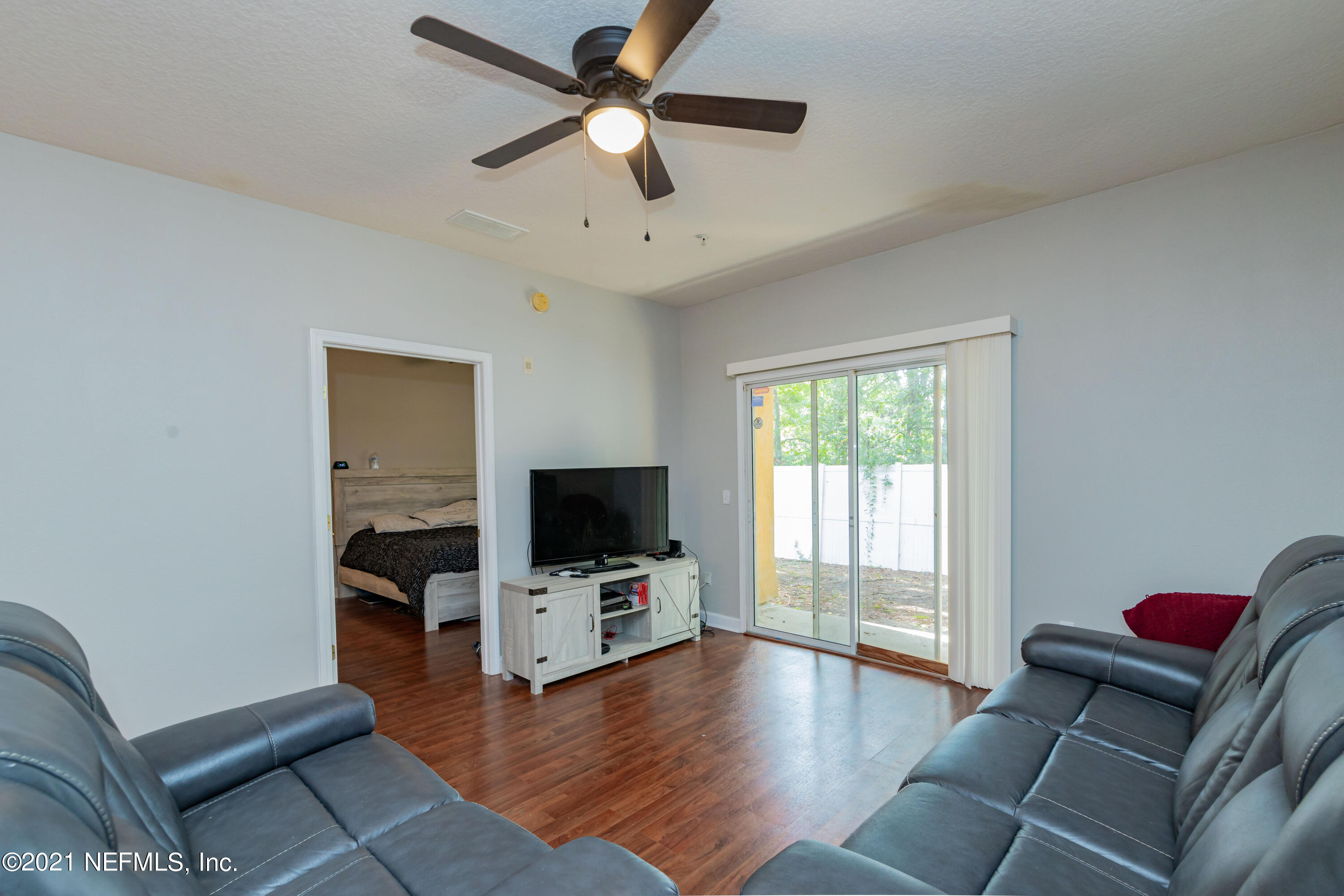 3670 Kirkpatrick Circle, Unit 2 Jacksonville, FL 32210 - Photo 8 of 17 a living room with furniture and a flat screen tv