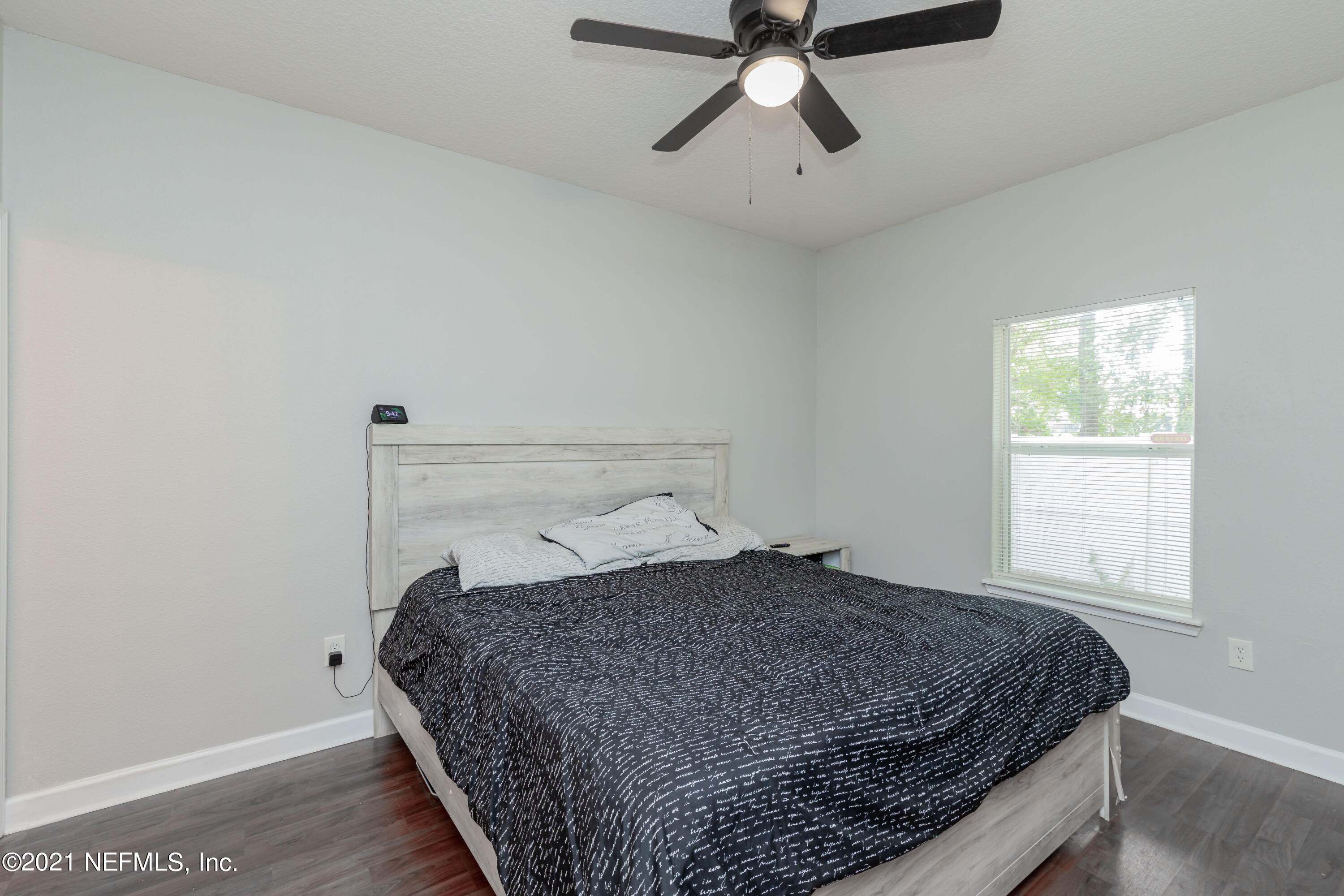 3670 Kirkpatrick Circle, Unit 2 Jacksonville, FL 32210 - Photo 9 of 17 a bedroom with a bed and window