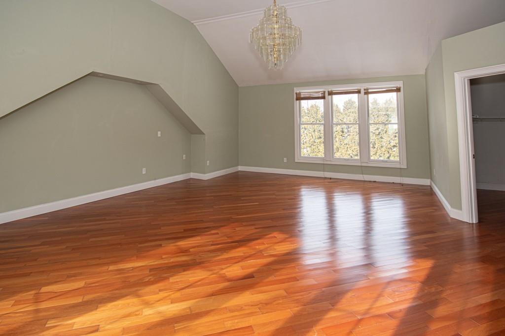 1103 Morgan Road West Springfield, MA 01089 - Photo 12 of 22 a view of an empty room with wooden floor and a window