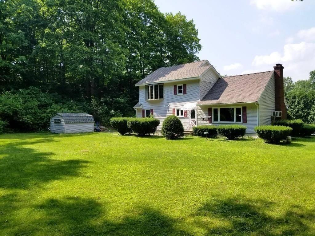 1103 Morgan Road West Springfield, MA 01089 - Photo 19 of 22 a front view of a house with a garden