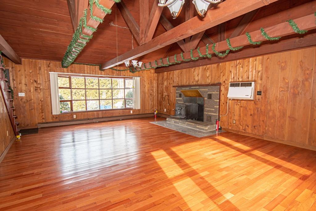 1103 Morgan Road West Springfield, MA 01089 - Photo 4 of 22 a view of empty room with wooden floor and fireplace