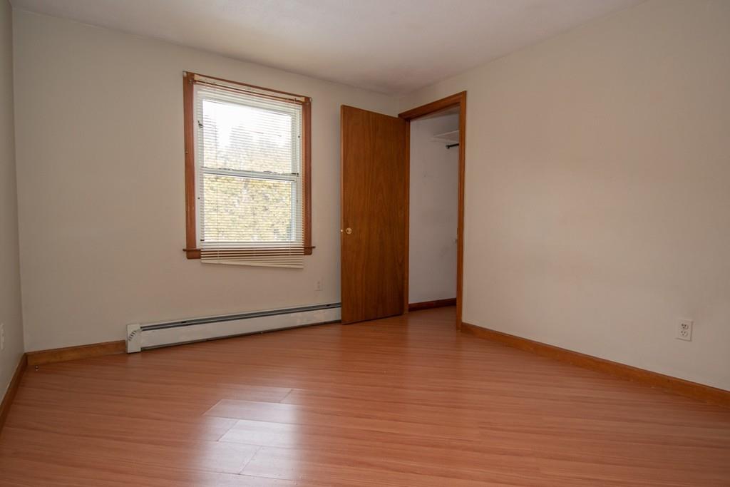 1103 Morgan Road West Springfield, MA 01089 - Photo 7 of 22 an empty room with wooden floor and windows