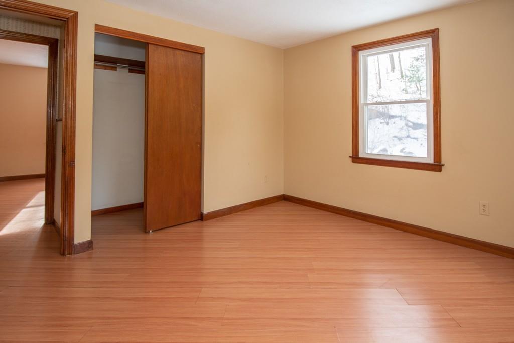 1103 Morgan Road West Springfield, MA 01089 - Photo 8 of 22 a view of an empty room with wooden floor and a window
