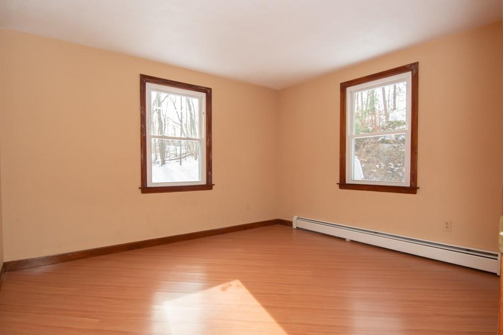 1103 Morgan Road West Springfield, MA 01089 - Photo 9 of 22 a view of a big room with windows and chandelier fan