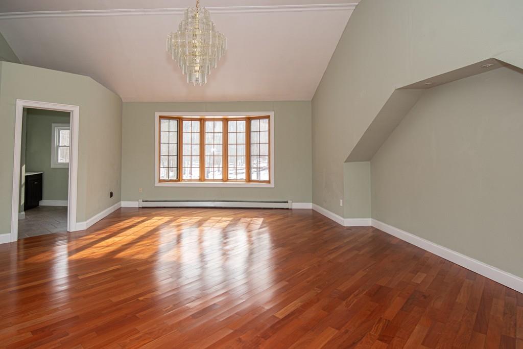 1103 Morgan Road West Springfield, MA 01089 - Photo 10 of 22 an empty room with wooden floor and windows