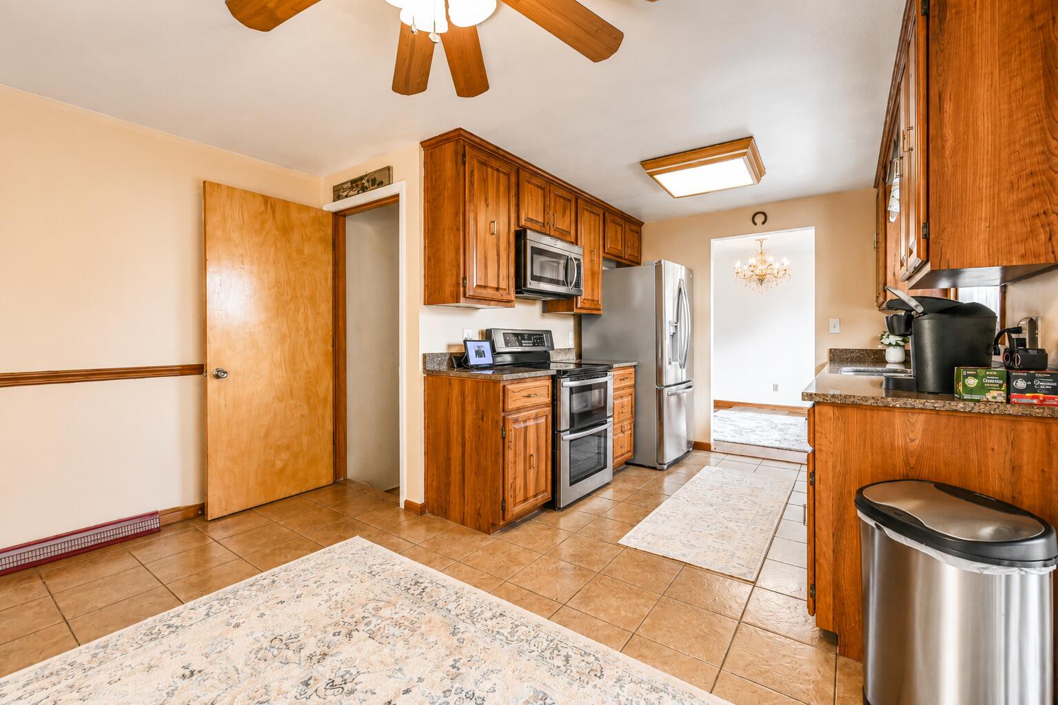 4428 Phoenix Drive Springfield, OH 45503 - Photo 11 of 35 Eat in area truly makes this kitchen the HUB of the home. Ceramic tiled flooring covers this area. Sliders access the back patio