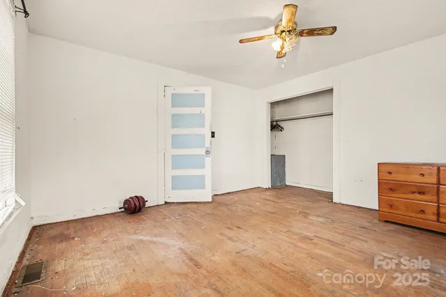a view of a bedroom with closet