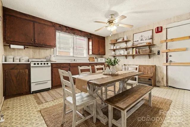 a kitchen with stainless steel appliances granite countertop a sink and cabinets