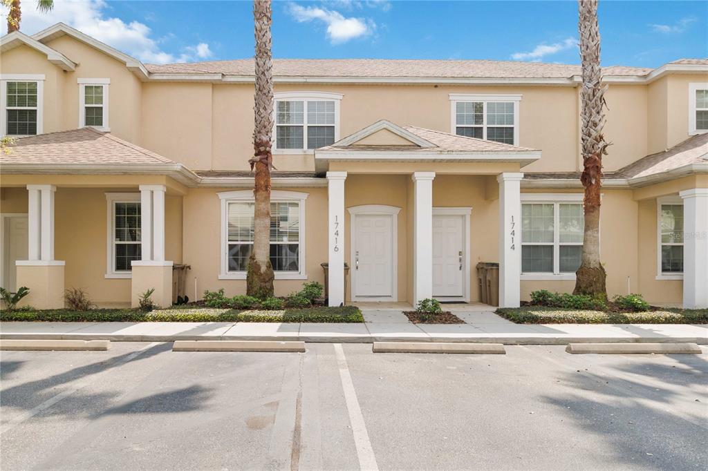 17416 Placidity Avenue Clermont, FL 34714 - Photo 1 of 1 a front view of a house with a road