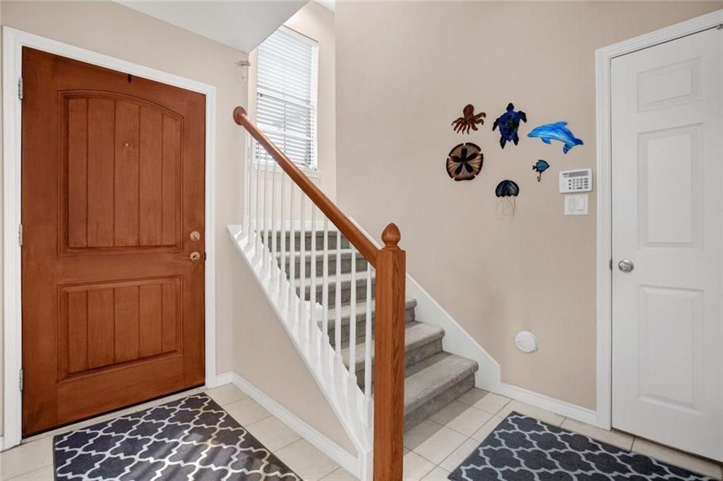 2018 Azure Pointe Richardson, TX 75080 - Photo 6 of 8 a view of entryway with stairs and furniture