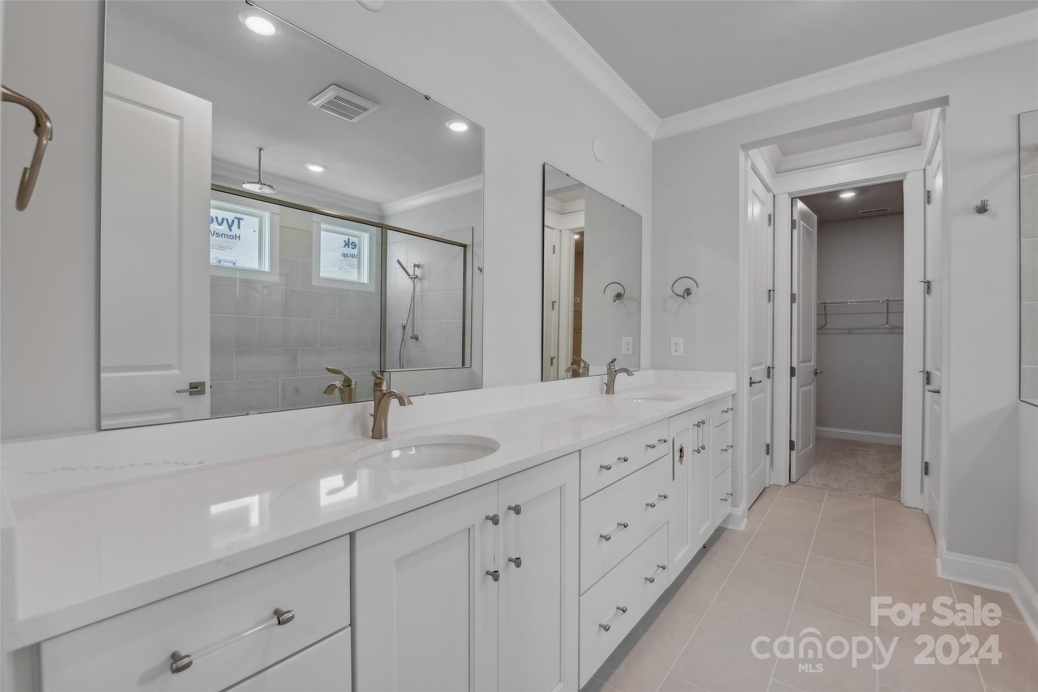 142 Windy Dell Drive Tega Cay, SC 29708 - Photo 15 of 20 a bathroom with double sink and a mirror